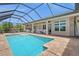 Inviting pool and outdoor seating area, perfect for relaxing and enjoying the outdoors at 158 Mariner Ln, Rotonda West, FL 33947