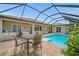 Inviting pool and patio area for outdoor entertainment and relaxation at 158 Mariner Ln, Rotonda West, FL 33947