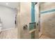 Walk-in shower with mosaic tile accent and rainfall shower head at 158 Mariner Ln, Rotonda West, FL 33947