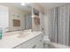 Bathroom featuring a vanity with ample counter space, a mirror, and a shower with whale-themed curtain at 1909 Johannesberg Rd, North Port, FL 34288