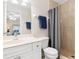Bathroom featuring a vanity, toilet and a glass-enclosed shower, offering a clean and modern look at 1909 Johannesberg Rd, North Port, FL 34288