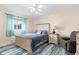 Bedroom with a comfortable queen-size bed, dresser, and a neutral color scheme at 1909 Johannesberg Rd, North Port, FL 34288