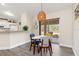 Dining area with a modern light fixture and access to a covered patio at 1909 Johannesberg Rd, North Port, FL 34288