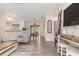 Living room featuring a dinette area, updated flooring, and natural light at 1909 Johannesberg Rd, North Port, FL 34288