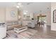 Open concept living and dining room with updated flooring, neutral walls, and natural lighting at 1909 Johannesberg Rd, North Port, FL 34288