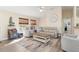 Bright and airy living room with neutral paint, ceiling fan, and modern flooring at 1909 Johannesberg Rd, North Port, FL 34288