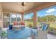 Inviting screened patio offers ample seating with views of the lush green yard at 1909 Johannesberg Rd, North Port, FL 34288