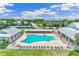 Aerial shot of a pool and tennis courts nestled in the community, surrounded by homes at 2136 Royal Tern Cir, Punta Gorda, FL 33983