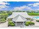 Aerial view of the clubhouse and recreation area surrounded by lush green landscaping at 2136 Royal Tern Cir # 20, Punta Gorda, FL 33983