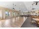 Spacious banquet hall with ample seating, ceiling fans, and large windows offering abundant natural light at 2136 Royal Tern Cir, Punta Gorda, FL 33983