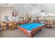Entertainment area with a pool table, TV, and multiple seating areas in clubhouse at 2136 Royal Tern Cir, Punta Gorda, FL 33983