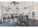 Well-equipped fitness center with multiple machines and ceiling fans at 2136 Royal Tern Cir, Punta Gorda, FL 33983