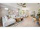 Stylish living room with modern furniture, tile floors, and an adjacent dining area at 2136 Royal Tern Cir, Punta Gorda, FL 33983