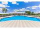 Beautiful outdoor pool with ample seating and a view of lush landscaping at 2136 Royal Tern Cir, Punta Gorda, FL 33983