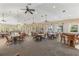 Spacious clubhouse with dining area, ceiling fans, and an abundance of natural light at 2138 Royal Tern Cir, Punta Gorda, FL 33983