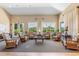The community room features comfortable chairs and large windows providing ample natural light at 2138 Royal Tern Cir, Punta Gorda, FL 33983