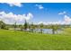 The beautiful green space offers lovely waterfront views, trees, and lush landscaping at 2138 Royal Tern Cir, Punta Gorda, FL 33983