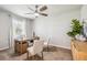 Well-lit home office space features a ceiling fan, neutral paint, and wood-look furniture at 2138 Royal Tern Cir, Punta Gorda, FL 33983