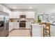 Bright kitchen featuring white cabinetry, stainless steel appliances, and an open layout at 2138 Royal Tern Cir, Punta Gorda, FL 33983