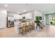 Modern kitchen with white cabinets, stainless steel appliances, and a quartz countertop island at 2138 Royal Tern Cir, Punta Gorda, FL 33983