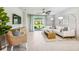 Bright living room with ceiling fan, sliding glass doors, and modern furnishings at 2138 Royal Tern Cir, Punta Gorda, FL 33983