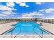 Inviting community pool surrounded by lounge chairs and lush landscaping at 2138 Royal Tern Cir, Punta Gorda, FL 33983