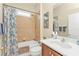 Bathroom features a shower-tub combo with a single sink vanity at 24036 Buckingham Way, Port Charlotte, FL 33980
