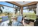 Relaxing enclosed lanai with comfortable seating and scenic views of the community and surrounding landscape at 24036 Buckingham Way, Port Charlotte, FL 33980