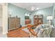 Bright living room features hardwood floors, built-in storage, and stylish furniture at 24036 Buckingham Way, Port Charlotte, FL 33980
