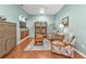 Cozy living room with hardwood floors, built in shelving and comfortable seating at 24036 Buckingham Way, Port Charlotte, FL 33980