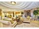 Inviting lobby area with comfortable seating, elegant decor, and abundant natural light at 24036 Buckingham Way, Port Charlotte, FL 33980