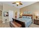 Comfortable bedroom with wood-look flooring, and decorative bedding at 24036 Buckingham Way, Port Charlotte, FL 33980