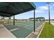 An outdoor shuffleboard court perfect for friendly games and enjoying the community's amenities at 24036 Buckingham Way, Port Charlotte, FL 33980