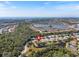 Aerial view of home in a tranquil community with a pond at 2479 Sonoma Dr W, Nokomis, FL 34275