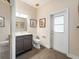 Well-lit bathroom featuring a modern vanity, framed mirror, and a glass-enclosed shower at 2479 Sonoma Dr W, Nokomis, FL 34275