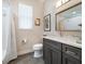 Well-lit bathroom featuring a sleek vanity with modern fixtures and a shower-tub combo at 2479 Sonoma Dr W, Nokomis, FL 34275