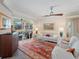 Comfortable living room featuring a decorative rug, sliding glass doors to the pool, and ample seating at 2479 Sonoma Dr W, Nokomis, FL 34275