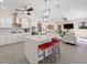 Open-concept living space featuring a kitchen with a center island, a living room and modern furnishings at 2479 Sonoma Dr W, Nokomis, FL 34275