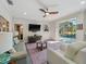 A spacious living room opens to the pool area through sliding glass doors, offering plenty of natural light at 2479 Sonoma Dr W, Nokomis, FL 34275