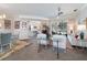 Spacious and well lit living space featuring tile flooring, large windows, and dining area at 2479 Sonoma Dr W, Nokomis, FL 34275