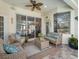 Enjoy the covered patio, perfect for relaxing with comfortable seating and seamless access to the home's interior at 2479 Sonoma Dr W, Nokomis, FL 34275