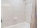 Clean and functional shower featuring white tile and a shower curtain, offering a simple bathing space at 2479 Sonoma Dr W, Nokomis, FL 34275
