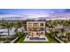 Aerial view of a home with a backyard pool and waterfront access at 36 Dolphin Dr, Treasure Island, FL 33706