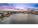 Expansive waterfront view showcasing the city skyline against a beautiful sunset sky at 36 Dolphin Dr, Treasure Island, FL 33706