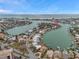 High angle aerial showcasing waterfront property nestled in a coastal community with bay views at 36 Dolphin Dr, Treasure Island, FL 33706