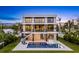 Back exterior featuring pool, lounge area, and staircase at 36 Dolphin Dr, Treasure Island, FL 33706