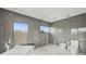 Modern bathroom with glass shower, stand alone tub and high end finishes at 36 Dolphin Dr, Treasure Island, FL 33706