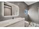 Modern bathroom featuring a large mirror, sleek fixtures, and tiled walls for a clean and contemporary feel at 36 Dolphin Dr, Treasure Island, FL 33706