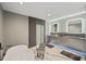 This bathroom includes a soaking tub, a double sink vanity, and marble floors at 36 Dolphin Dr, Treasure Island, FL 33706