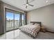 Bright bedroom with waterfront views, a ceiling fan, and a plush bed for ultimate relaxation at 36 Dolphin Dr, Treasure Island, FL 33706